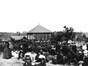 Old picture showing former bandstand surrounded by people sitting