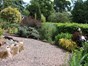 Gravel path with stream running alongside, ornamental and fragrant bedding
