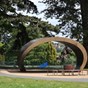 wooden seat shelter in middle of park