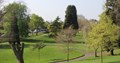 Grassed area, paths and trees in park
