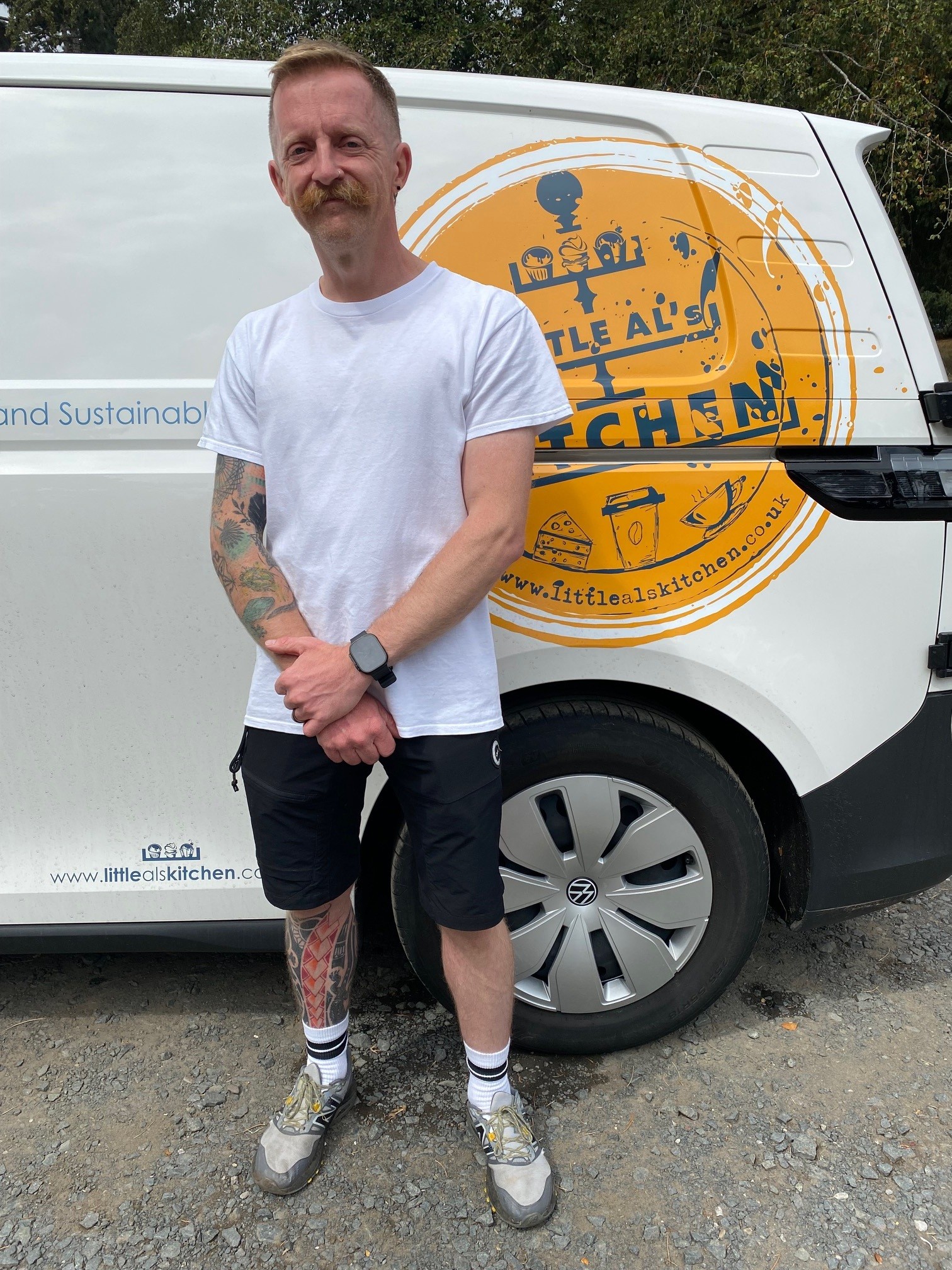man standing infront of van